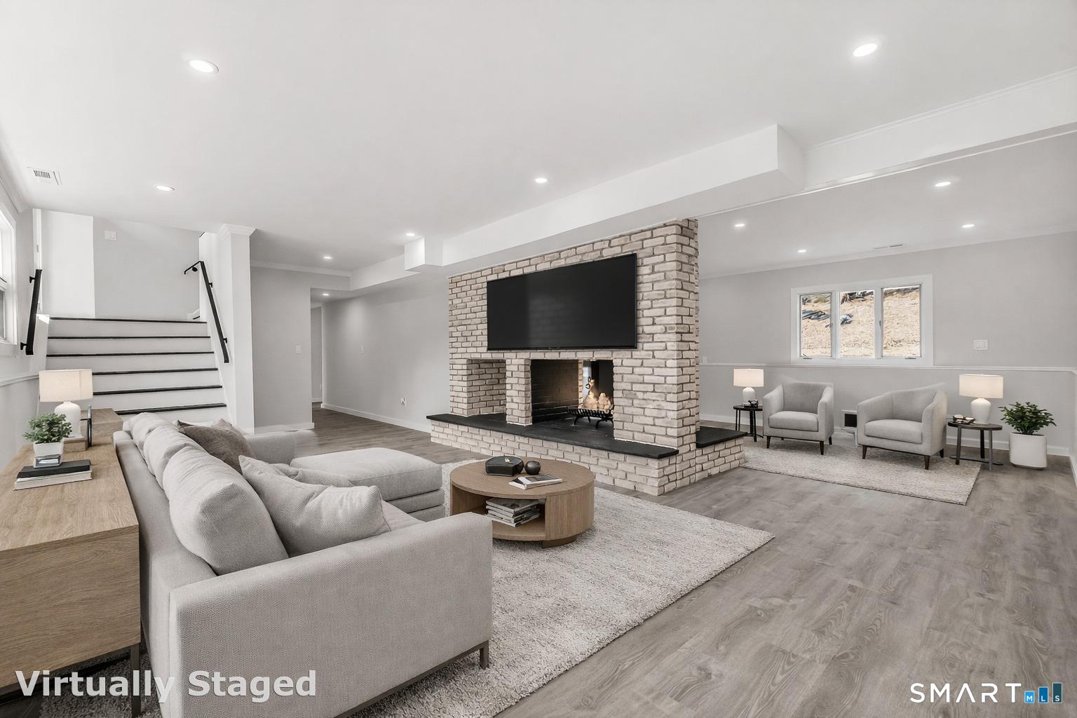 73 Buck Hill Road Easton, CT 06612 - Photo 28 of 44 a living room with furniture and a flat screen tv