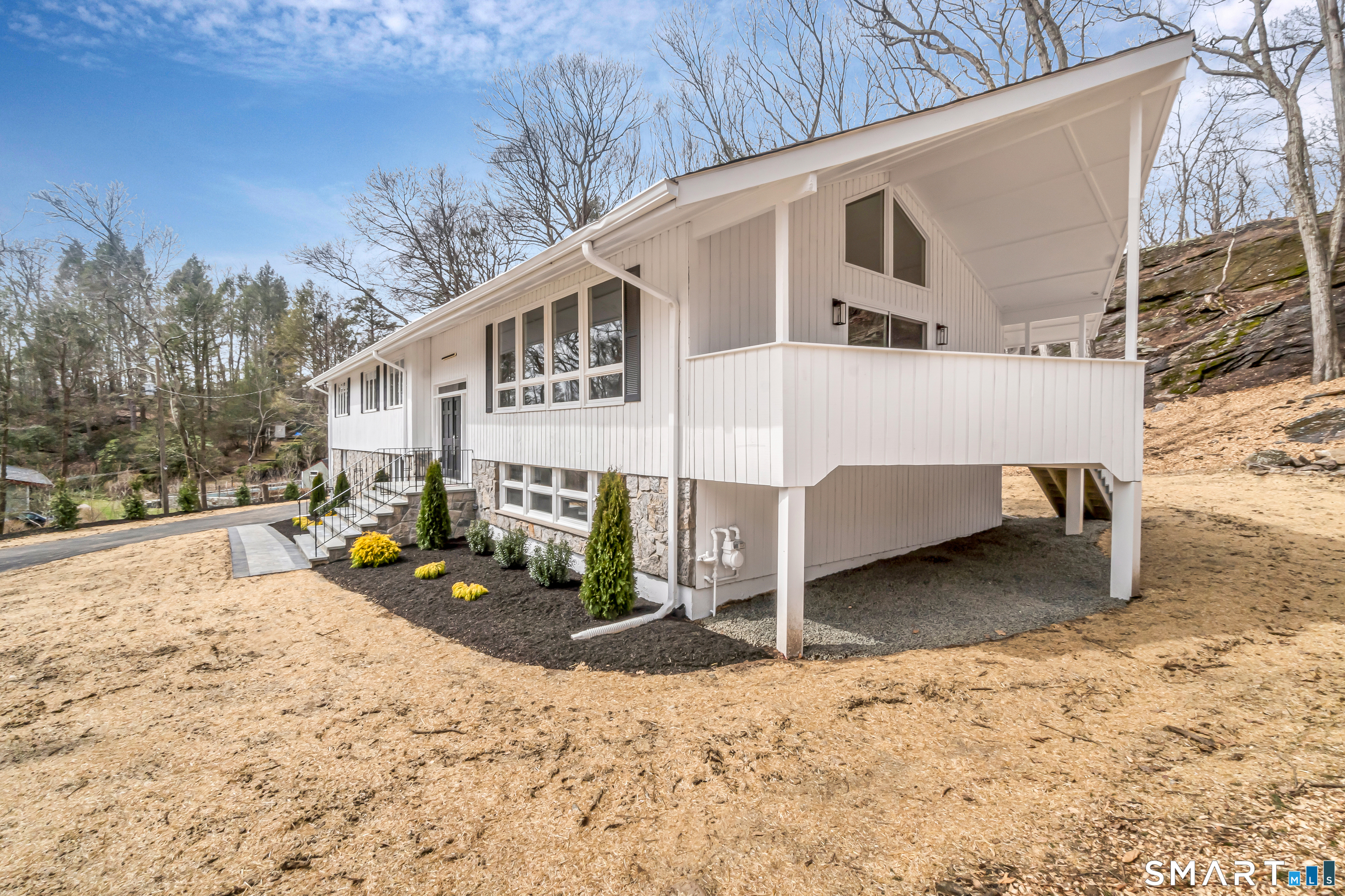 73 Buck Hill Road Easton, CT 06612 - Photo 3 of 44 a view of a house with a wooden fence