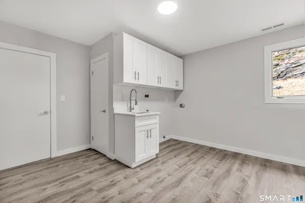 a view of kitchen with wooden floor