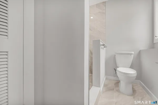 a close view of a toilet and a sink