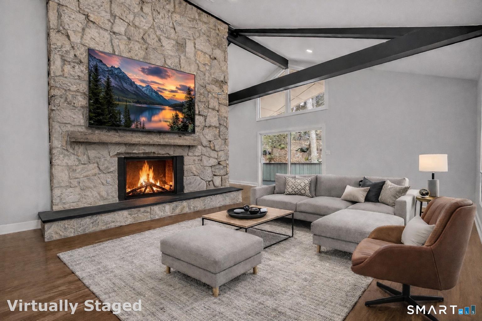 73 Buck Hill Road Easton, CT 06612 - Photo 6 of 44 a living room with furniture and a fireplace