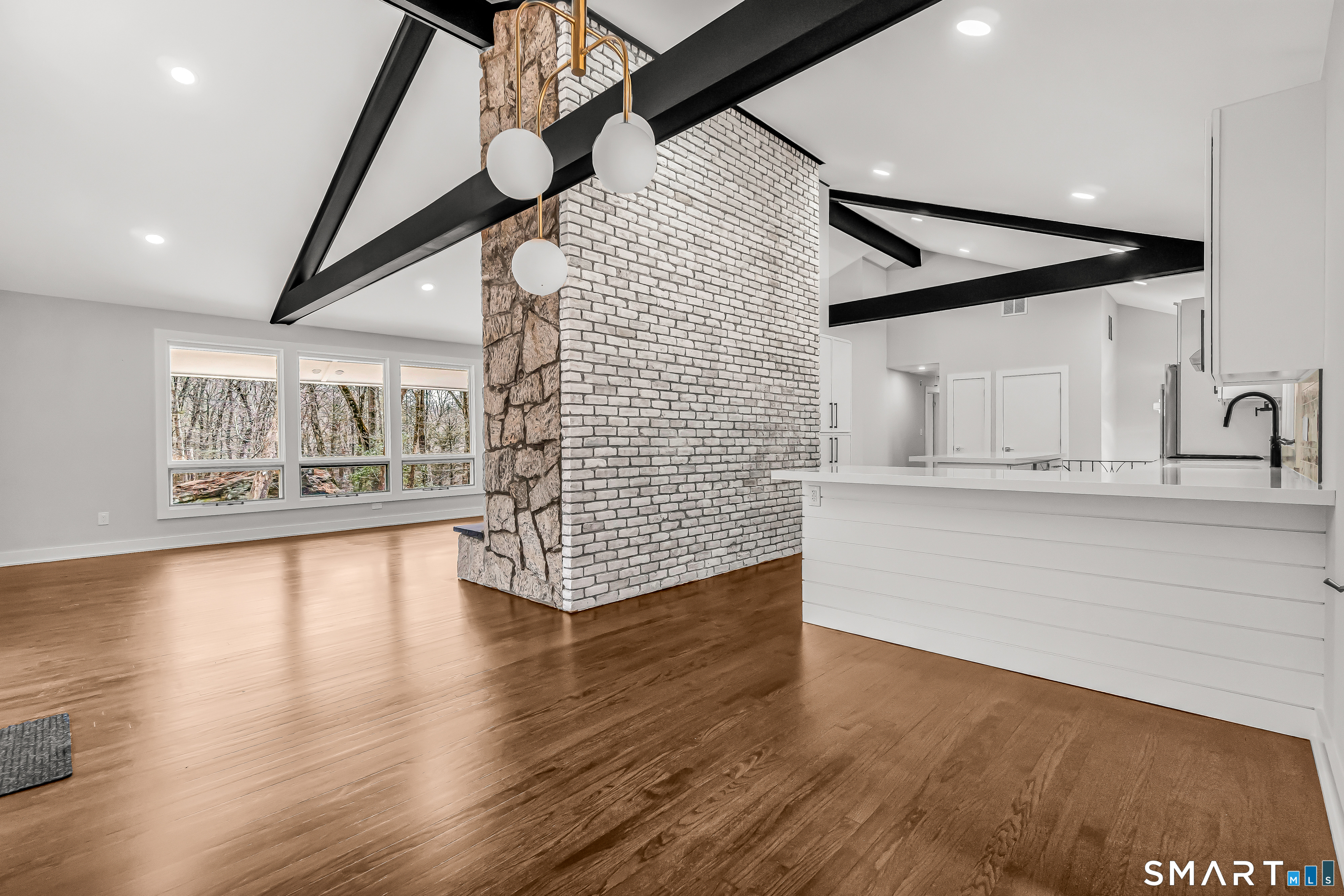 73 Buck Hill Road Easton, CT 06612 - Photo 8 of 44 a view of empty room with wooden floor and fan