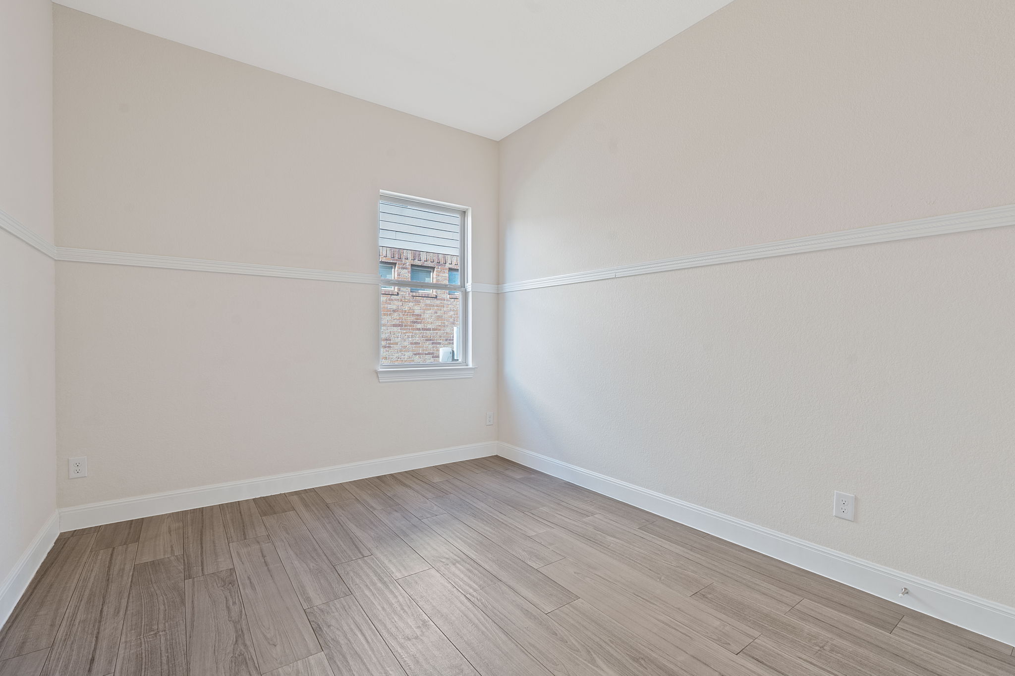 21100 Windmill Ranch Avenue Pflugerville, TX 78660 - Photo 15 of 29 Spare room with baseboards and light wood-type flooring