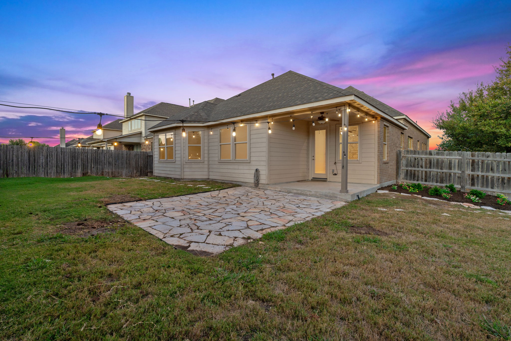 21100 Windmill Ranch Avenue Pflugerville, TX 78660 - Photo 17 of 29 Rear view of house with a patio area, a fenced backyard, a ceiling fan, and a shingled roof