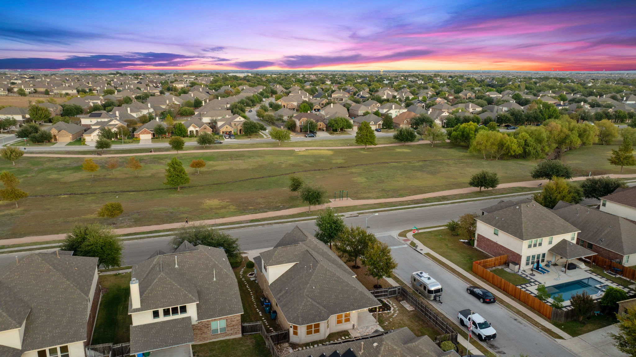 21100 Windmill Ranch Avenue Pflugerville, TX 78660 - Photo 3 of 29 Aerial view at dusk of a residential view