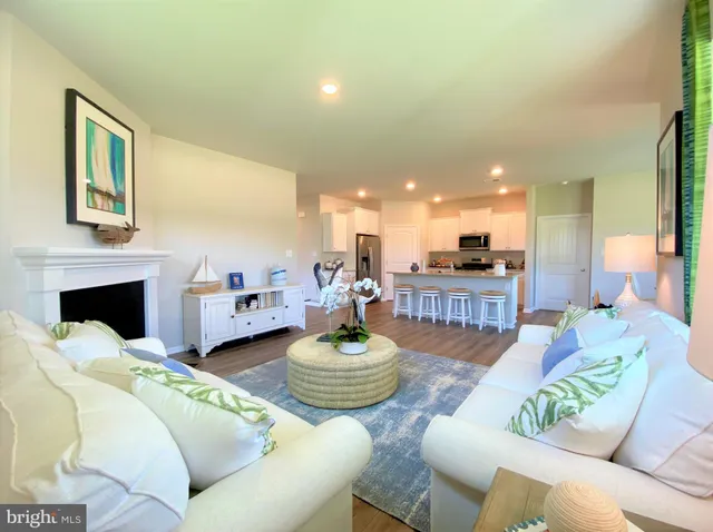 a spacious bedroom with a bed and a dresser next to a window