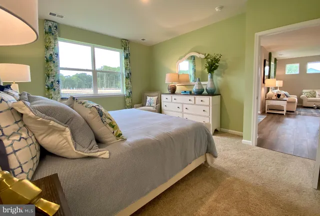 a bed room with a bed and a lamp