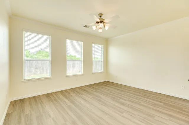 a kitchen with stainless steel appliances a refrigerator and a stove top oven