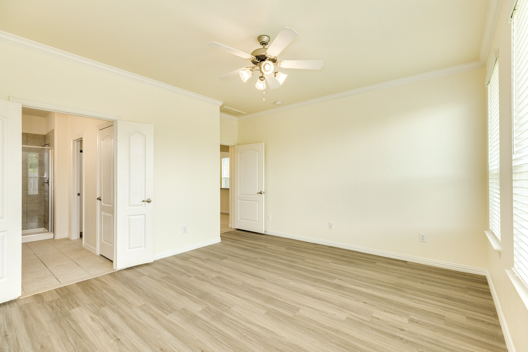 1301 Scarlet Mountain Drive Rosharon, TX 77583 - Photo 13 of 43 a view of a room with wooden floor and a ceiling fan