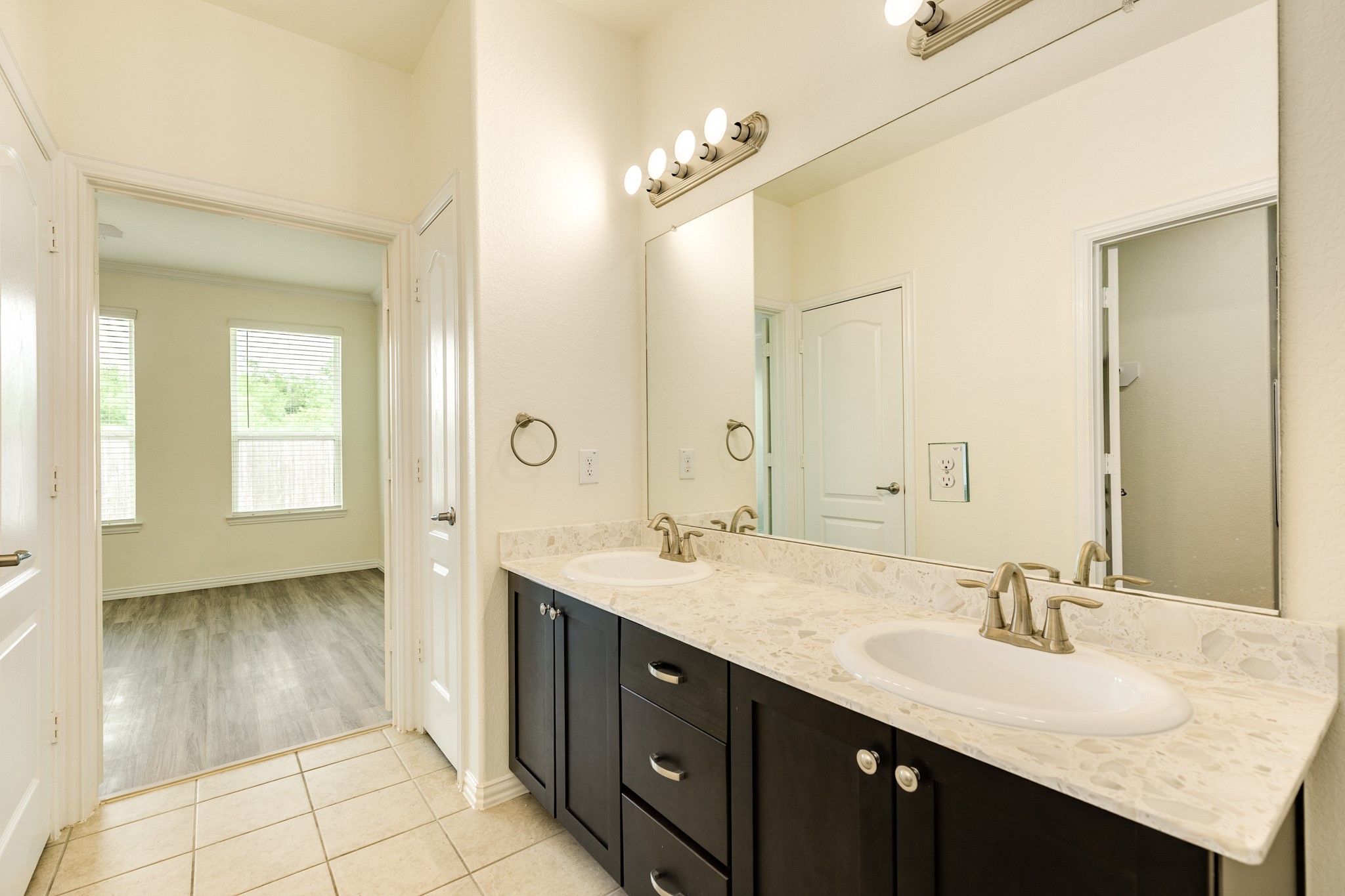 1301 Scarlet Mountain Drive Rosharon, TX 77583 - Photo 15 of 43 a spacious bathroom with a granite countertop sink a mirror and a shower