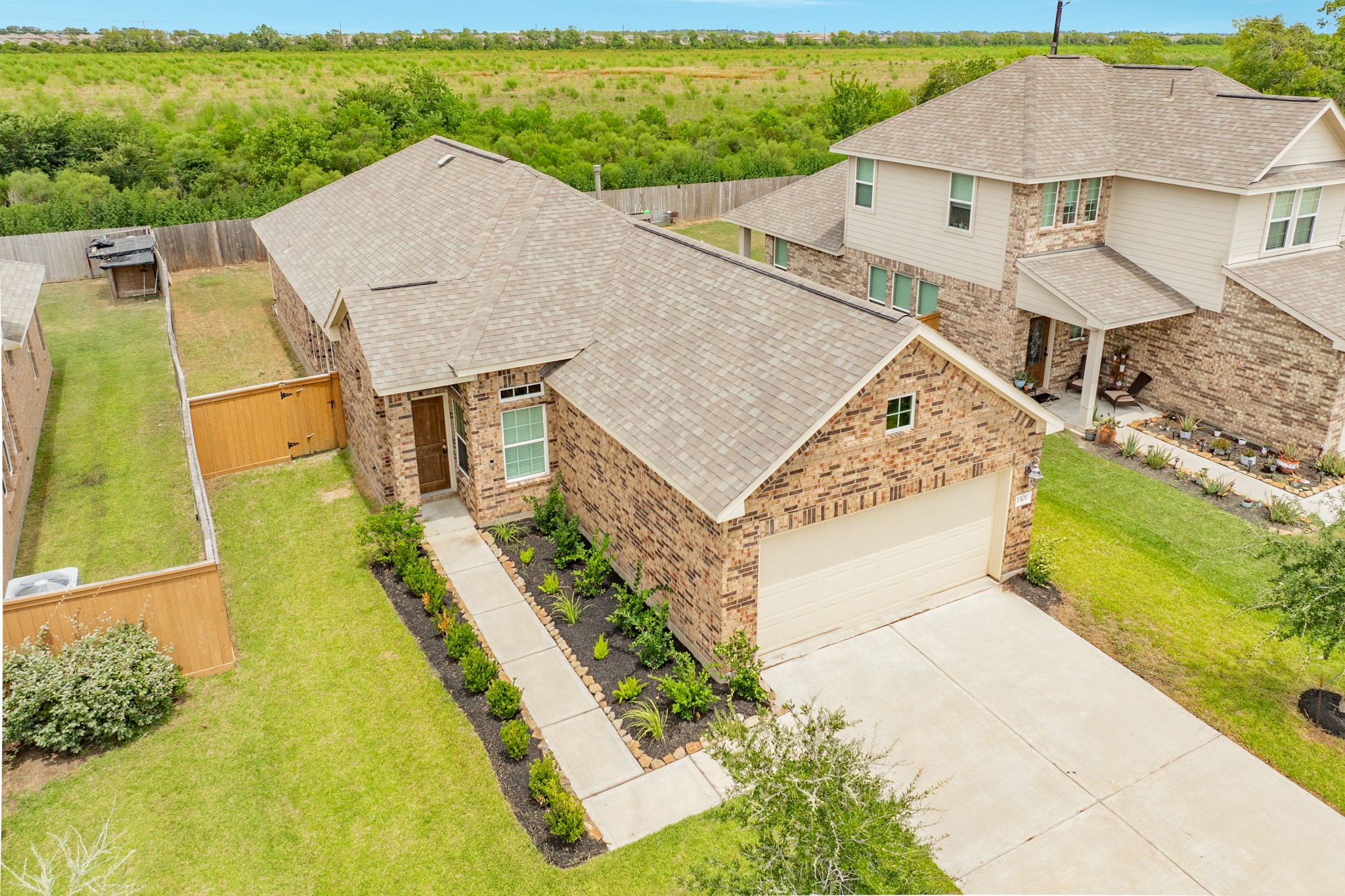 1301 Scarlet Mountain Drive Rosharon, TX 77583 - Photo 25 of 43 an aerial view of a house with a garden and swimming pool