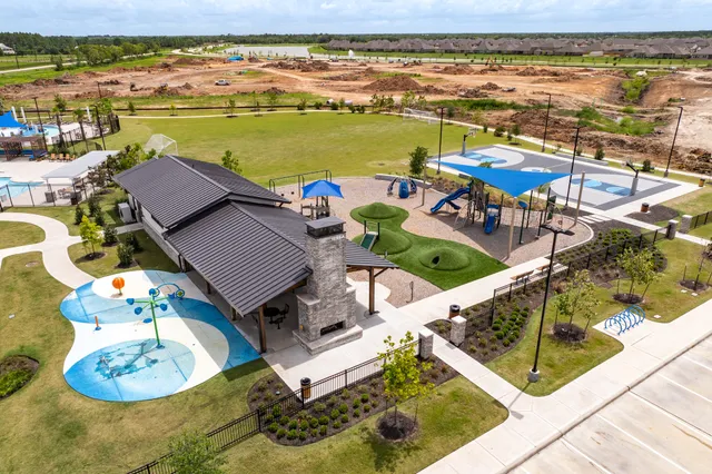 an aerial view of a house with outdoor seating