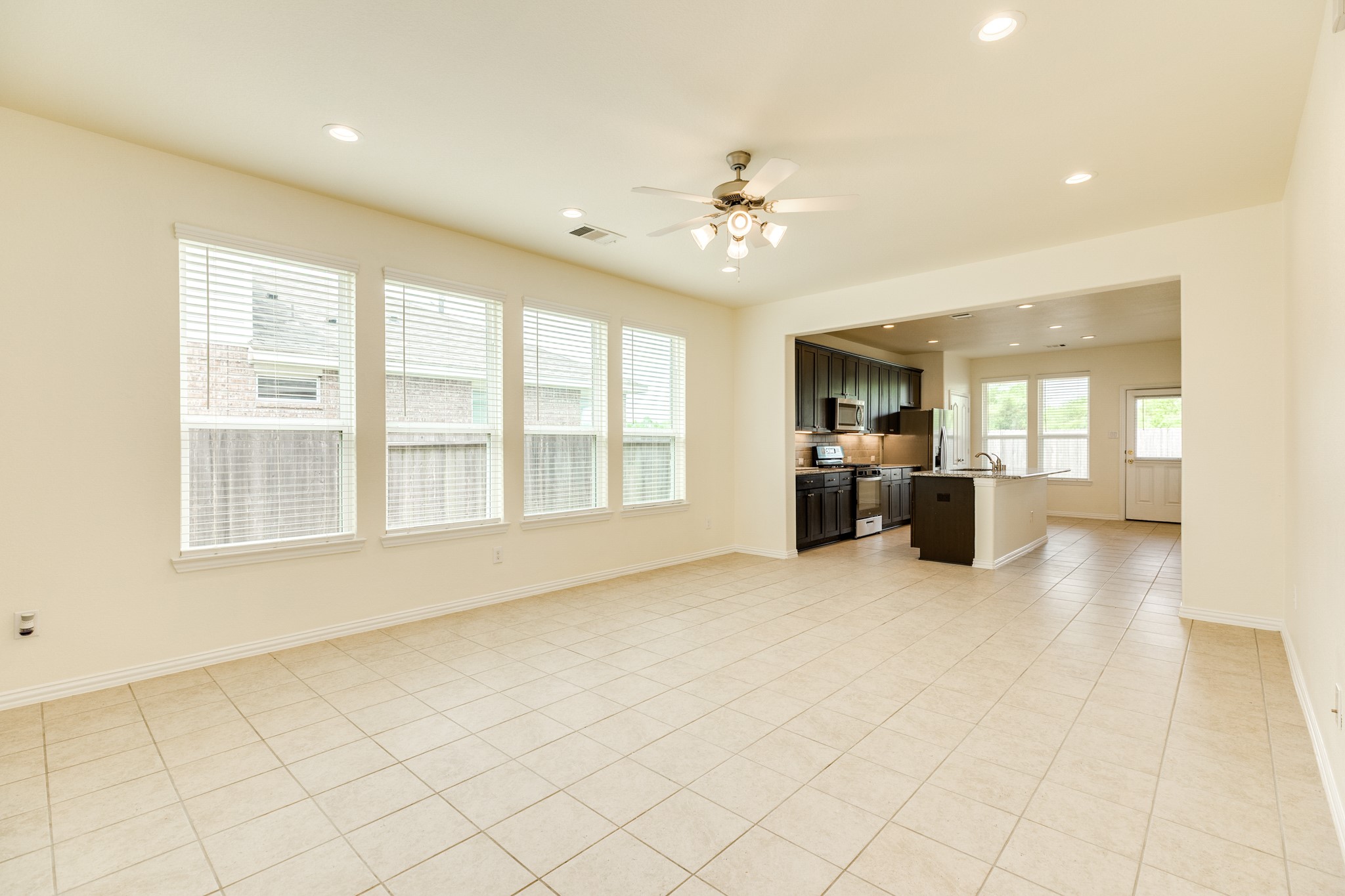 1301 Scarlet Mountain Drive Rosharon, TX 77583 - Photo 6 of 43 a view of an empty room with a kitchen