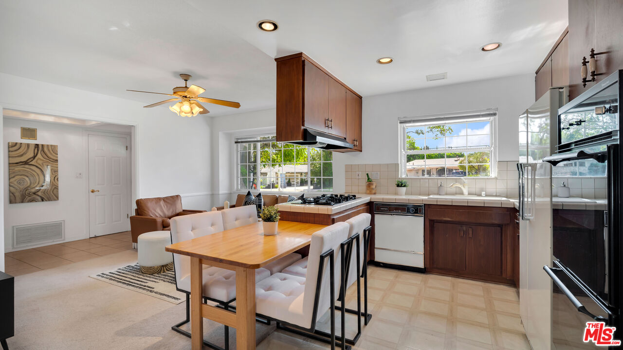 18501 Germain Street Porter Ranch, CA 91326 - Photo 14 of 55 a kitchen with a sink appliances and a counter top space