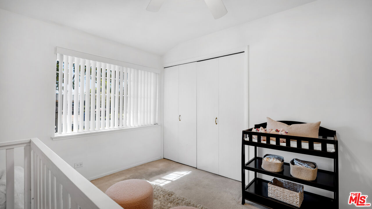 18501 Germain Street Porter Ranch, CA 91326 - Photo 23 of 55 a view of an empty room with wooden floor and a window