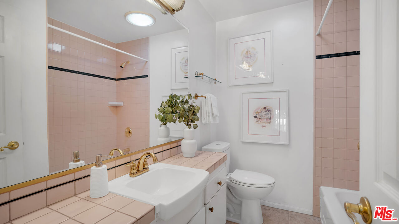 18501 Germain Street Porter Ranch, CA 91326 - Photo 24 of 55 a bathroom with a sink toilet and shower