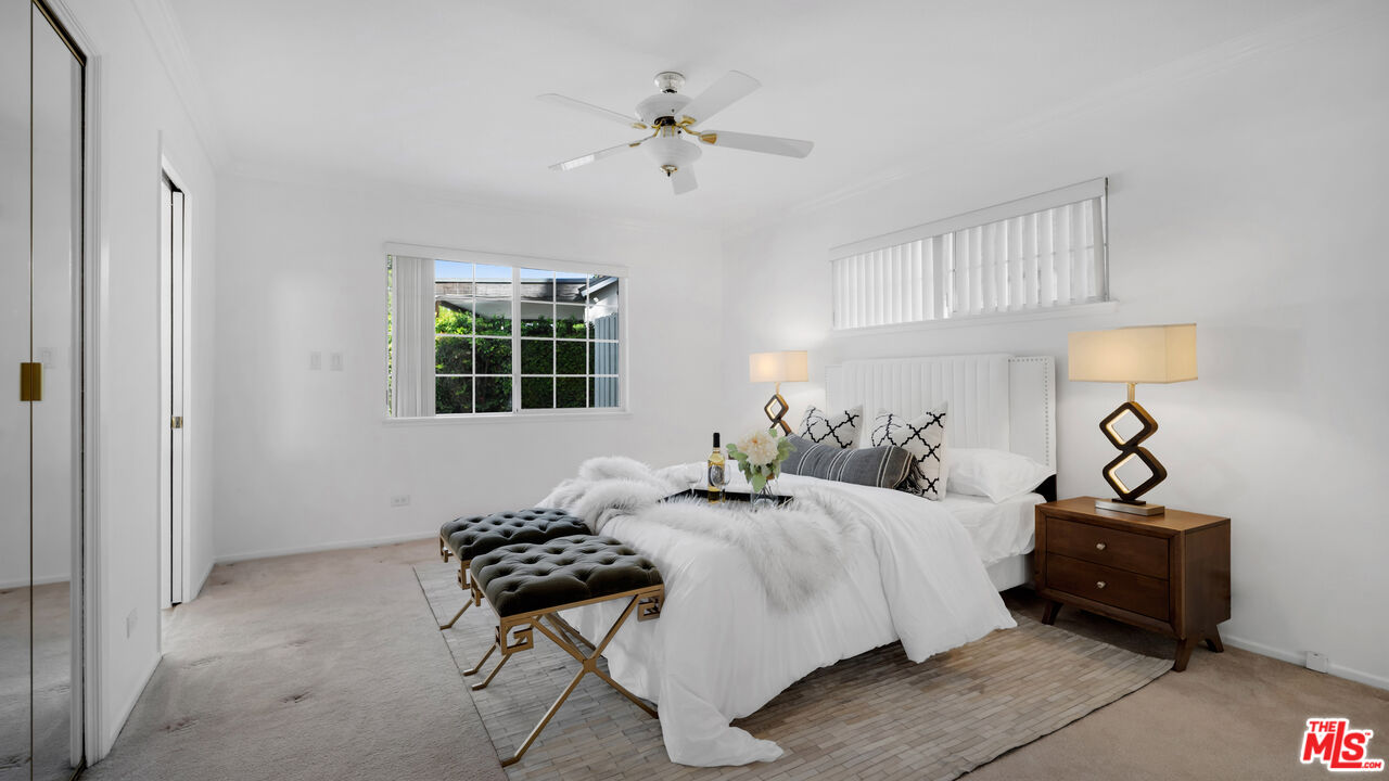 18501 Germain Street Porter Ranch, CA 91326 - Photo 26 of 55 a bedroom with bed and a window