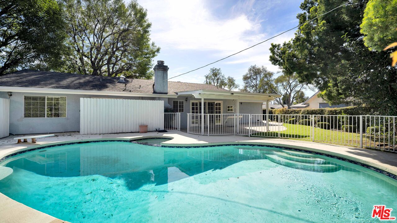 18501 Germain Street Porter Ranch, CA 91326 - Photo 3 of 55 a view of a house with a backyard and a small yard
