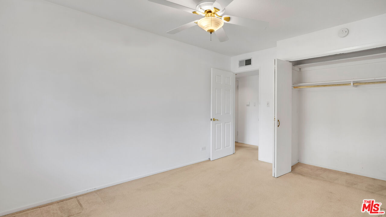 18501 Germain Street Porter Ranch, CA 91326 - Photo 32 of 55 a view of an empty room with a chandelier fan