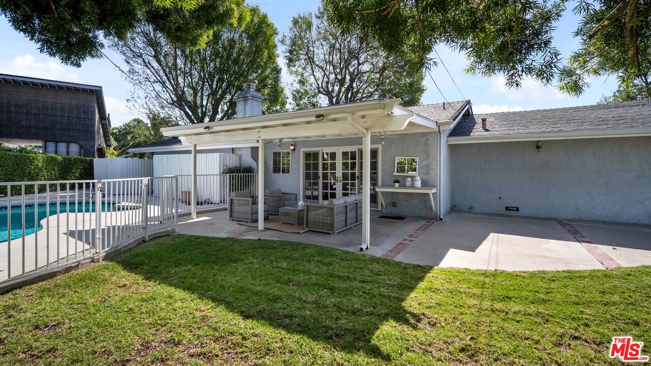 18501 Germain Street Porter Ranch, CA 91326 - Photo 36 of 55 a view of a house with a yard and furniture