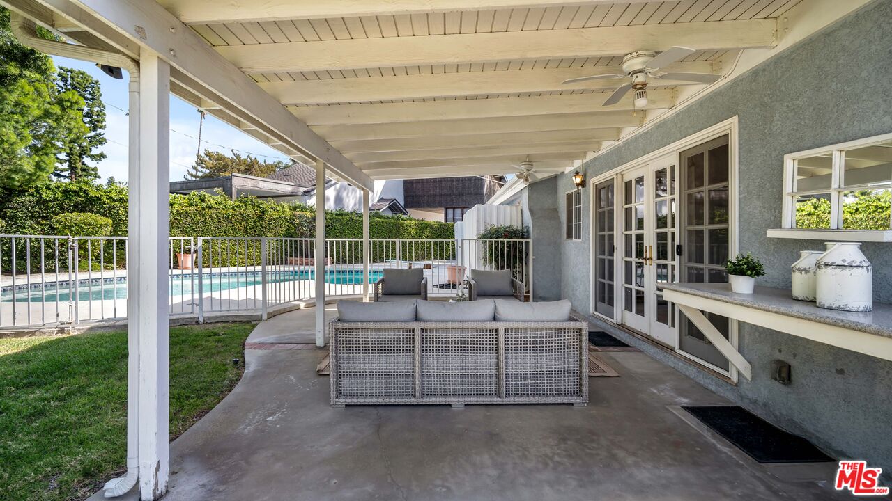18501 Germain Street Porter Ranch, CA 91326 - Photo 37 of 55 a bedroom with furniture and large windows