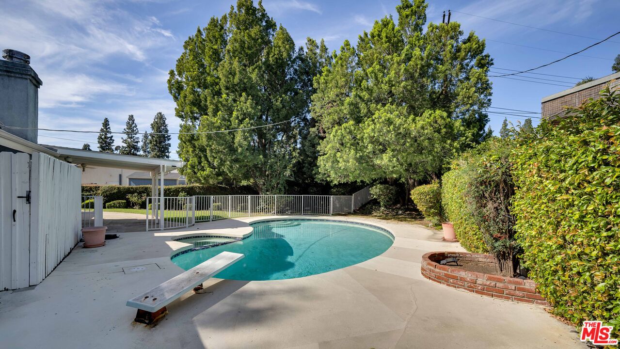 18501 Germain Street Porter Ranch, CA 91326 - Photo 41 of 55 a view of a swimming pool with a patio