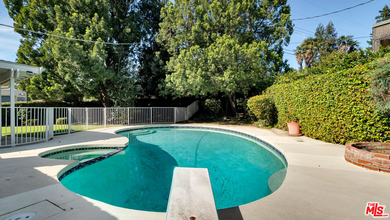 18501 Germain Street Porter Ranch, CA 91326 - Photo 43 of 55 a view of a swimming pool with a patio