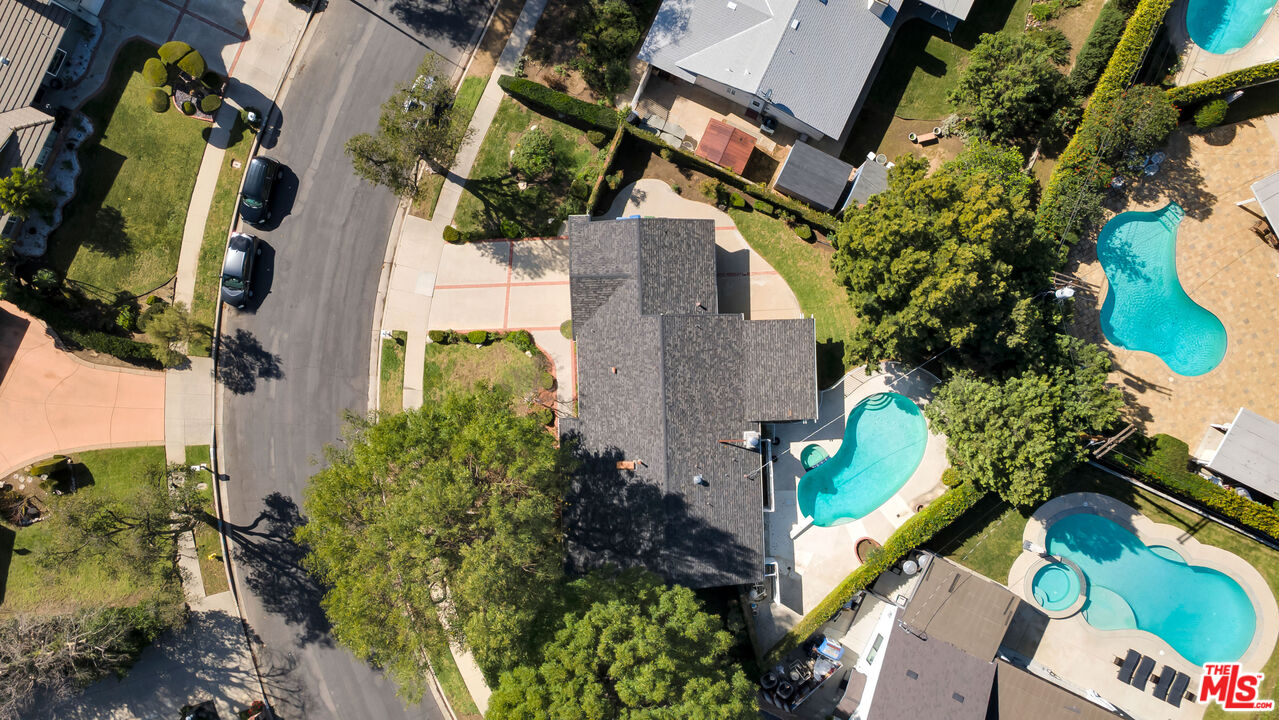 18501 Germain Street Porter Ranch, CA 91326 - Photo 44 of 55 an aerial view of a house with a yard and garden