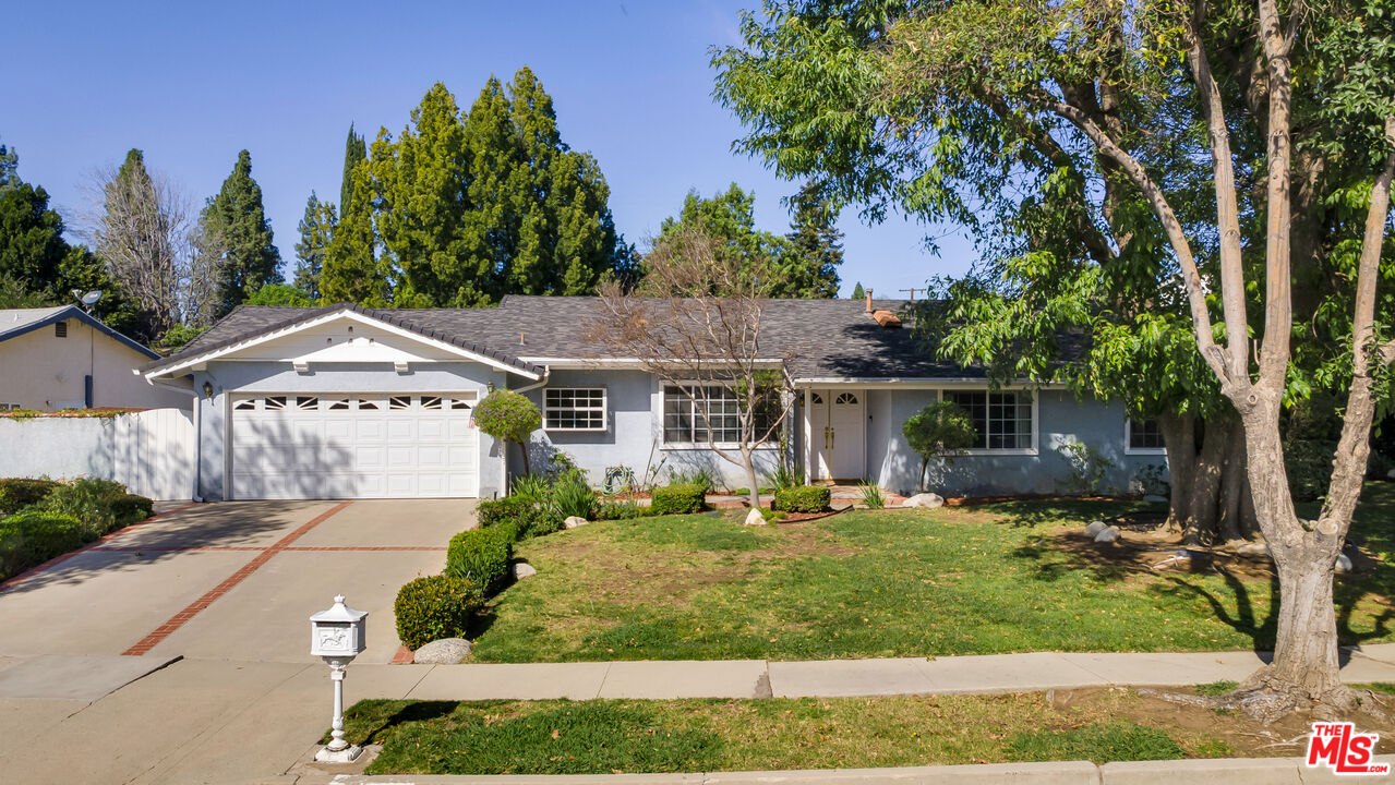 18501 Germain Street Porter Ranch, CA 91326 - Photo 45 of 55 front view of a house with a yard
