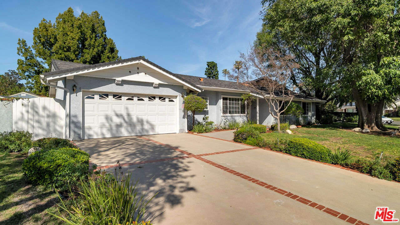 18501 Germain Street Porter Ranch, CA 91326 - Photo 47 of 55 a front view of a house with a yard