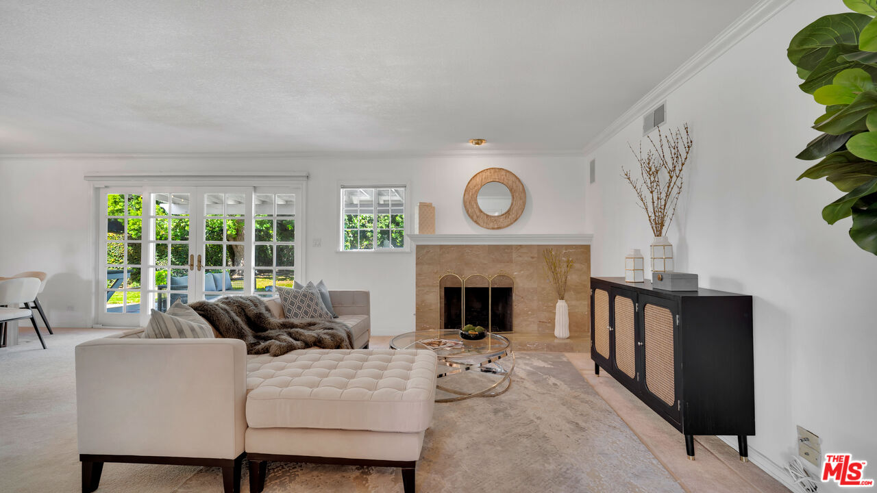 18501 Germain Street Porter Ranch, CA 91326 - Photo 6 of 55 a living room with furniture and a fireplace