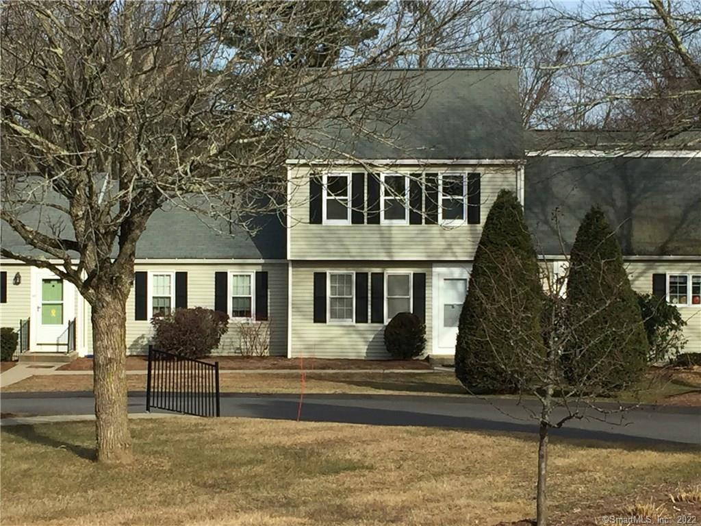 45 Constitution Square, Unit 45 Mansfield, CT 06250 - Photo 1 of 1 a front view of a house with garden