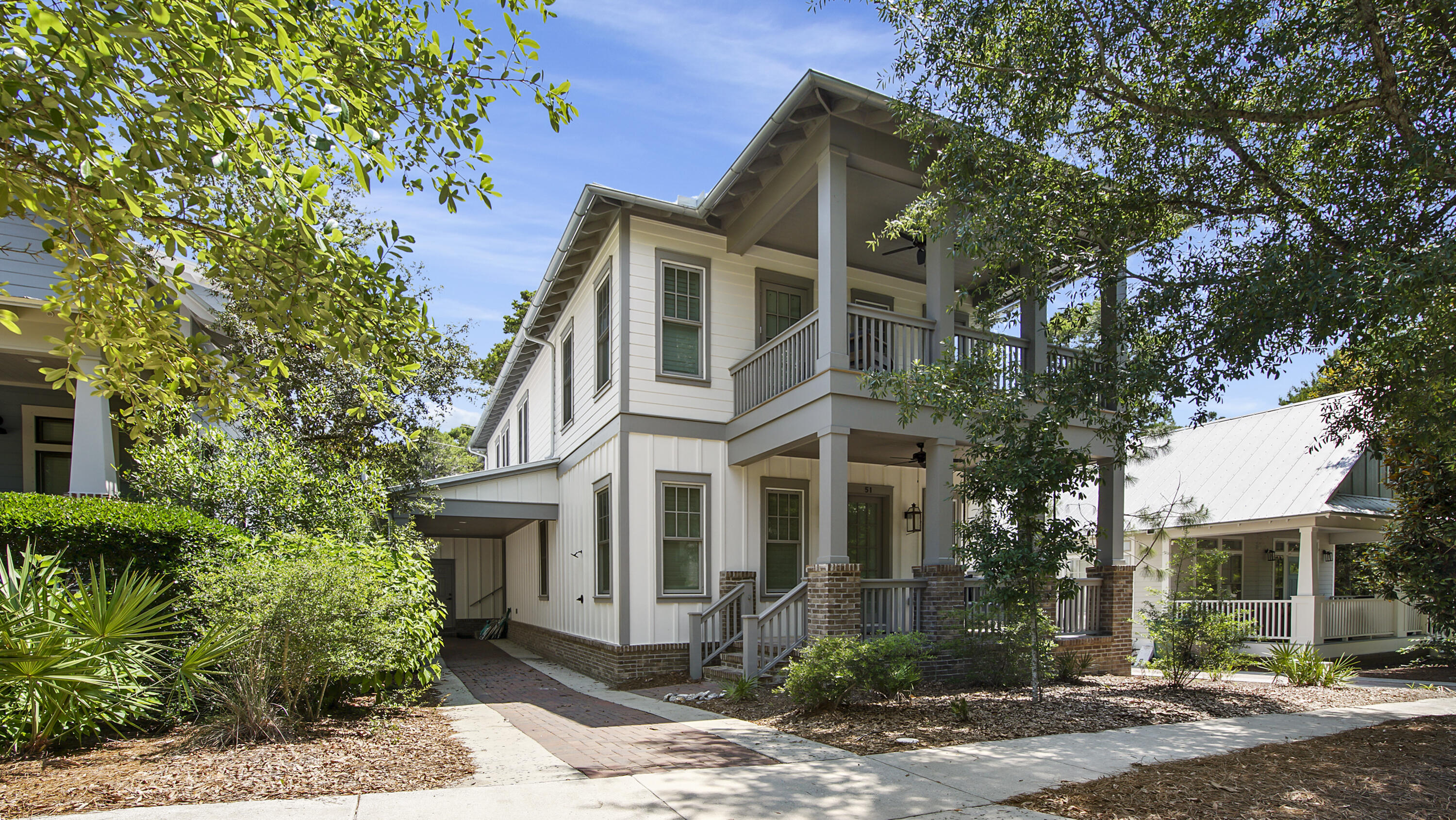 51 Okeechobee West Santa Rosa Beach, FL 32459 - Photo 1 of 78 a front view of a house with a yard and potted plants