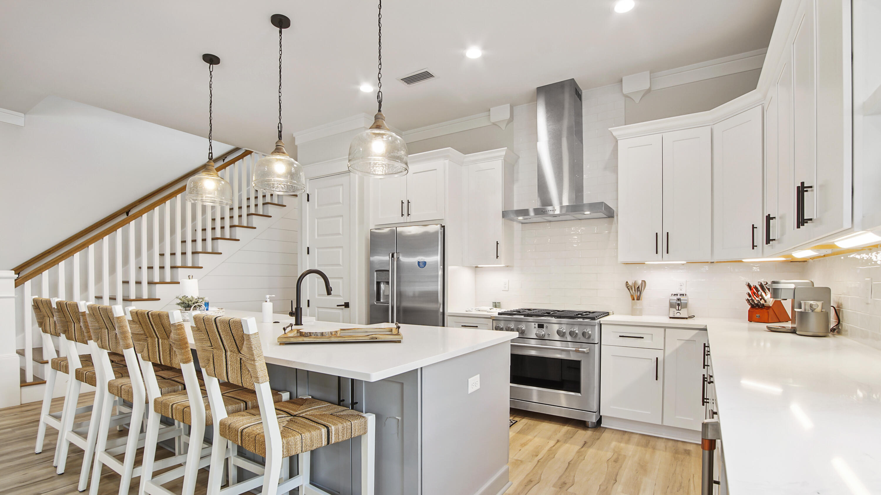 51 Okeechobee West Santa Rosa Beach, FL 32459 - Photo 13 of 78 a kitchen with stainless steel appliances kitchen island a stove a sink a center island and a wooden floor