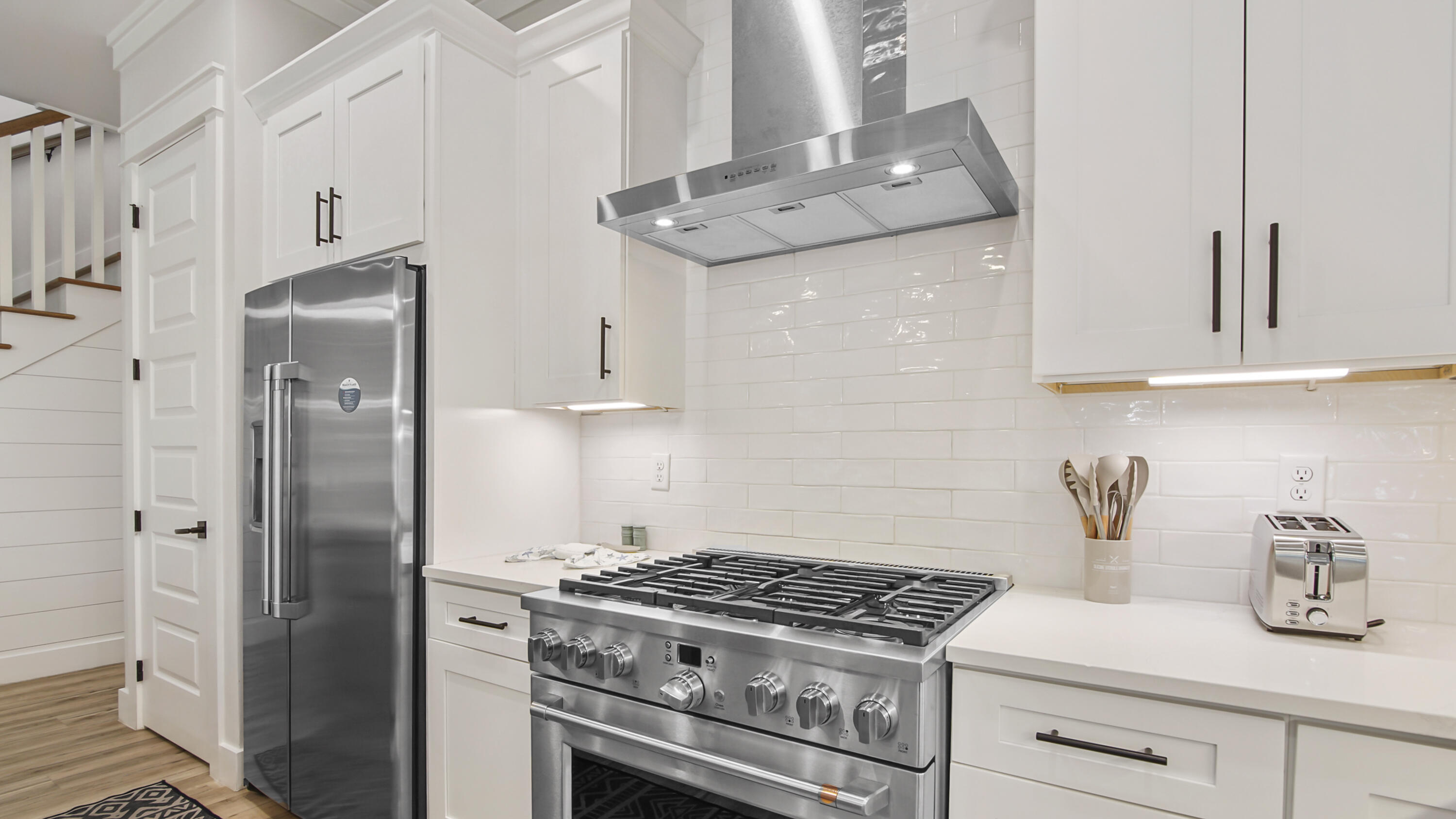 51 Okeechobee West Santa Rosa Beach, FL 32459 - Photo 17 of 78 a kitchen with stainless steel appliances granite countertop white cabinets and a stove