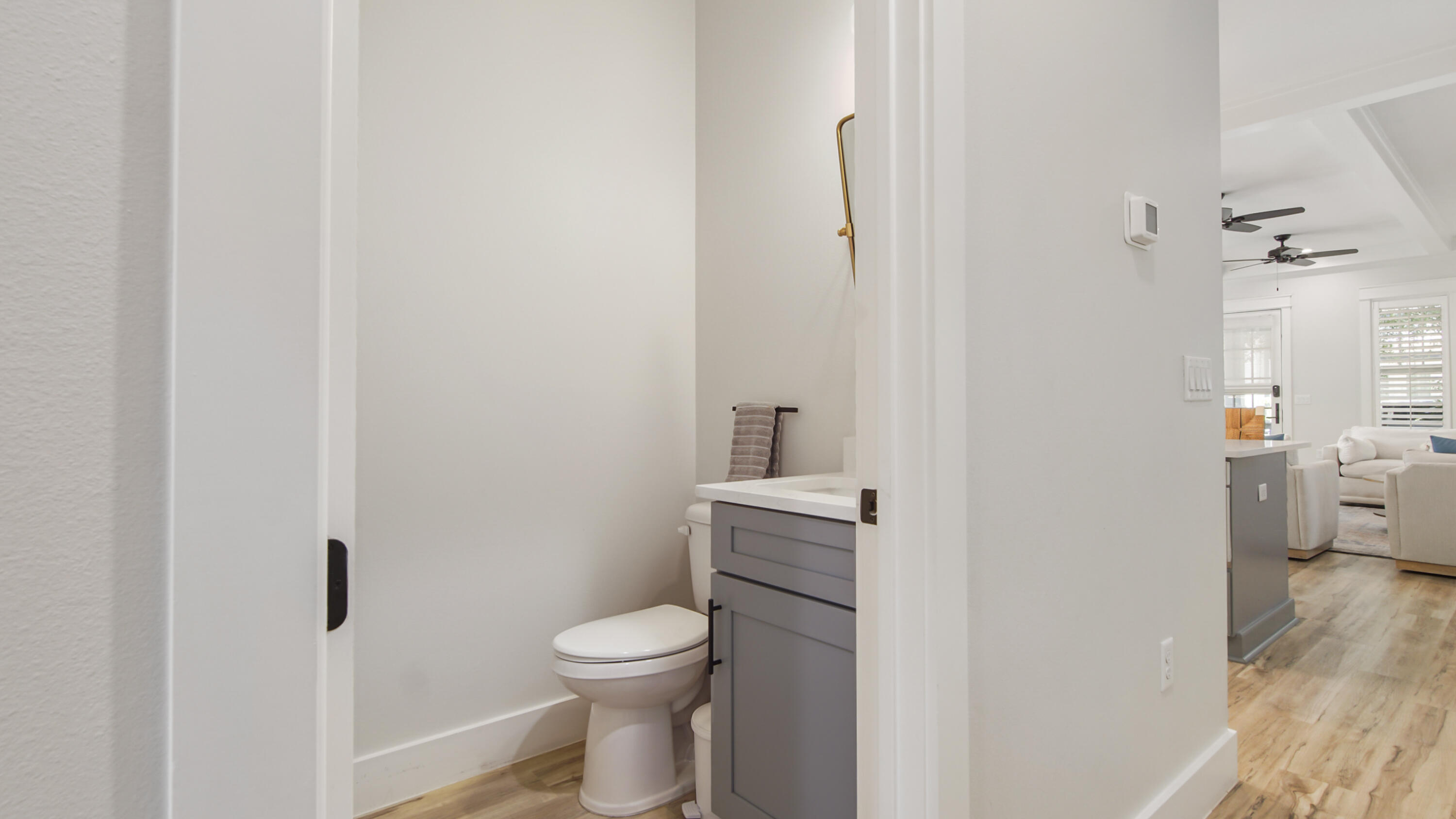 51 Okeechobee West Santa Rosa Beach, FL 32459 - Photo 19 of 78 a white toilet sitting next to a bathroom sink