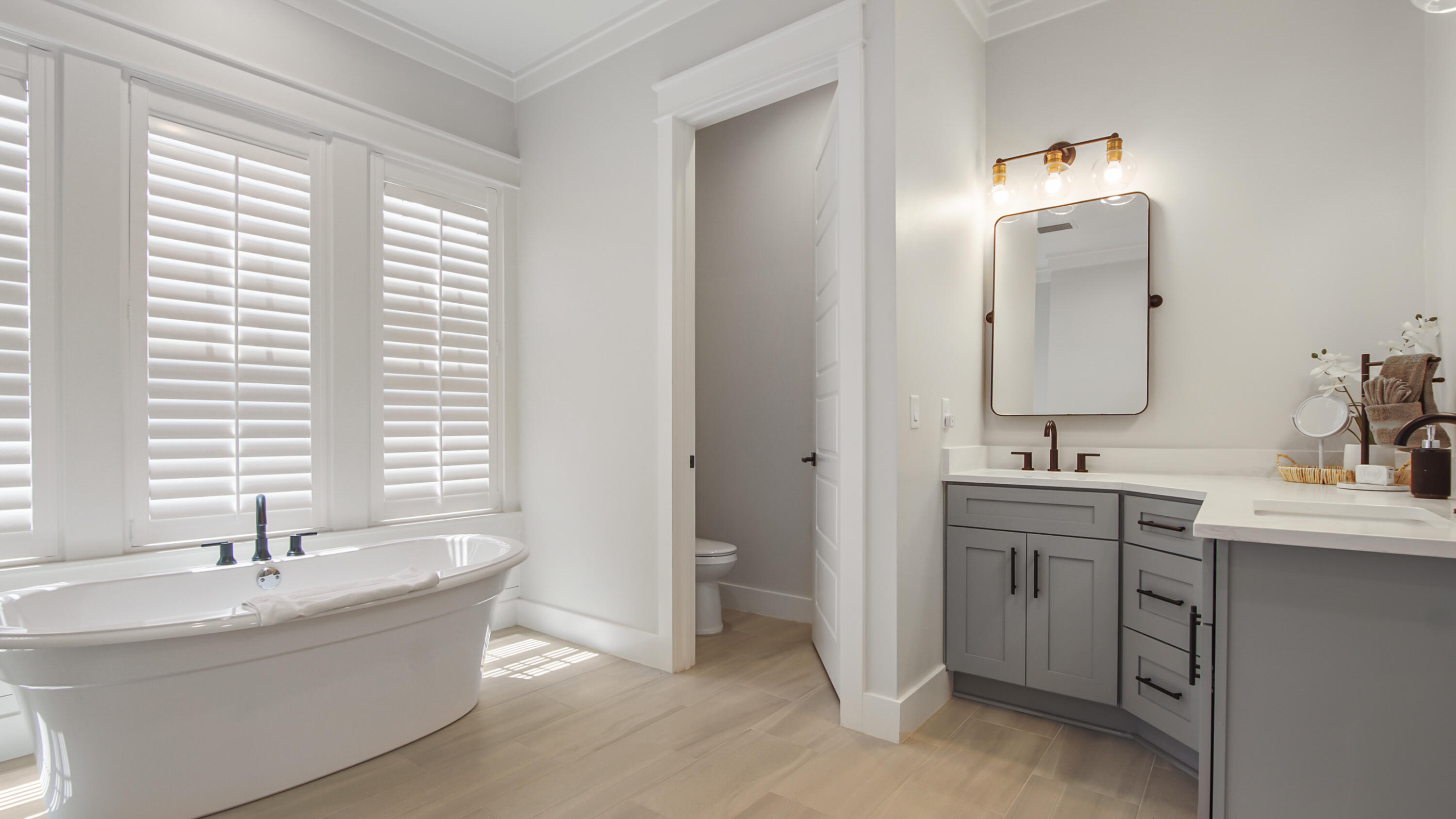 51 Okeechobee West Santa Rosa Beach, FL 32459 - Photo 28 of 78 a bathroom with a double vanity sink and mirror with bathtub