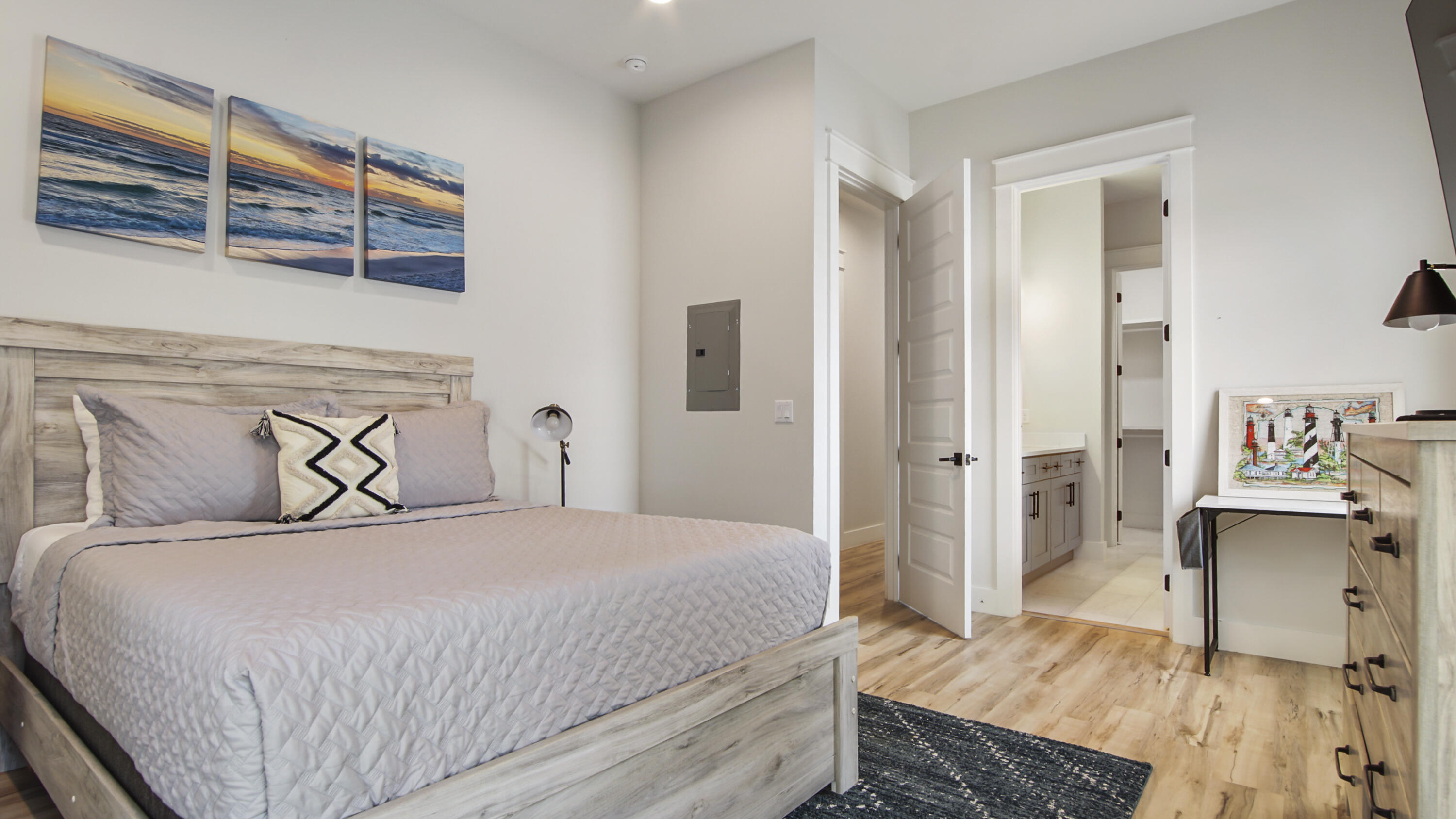 51 Okeechobee West Santa Rosa Beach, FL 32459 - Photo 57 of 78 a bedroom with a large bed and a chandelier