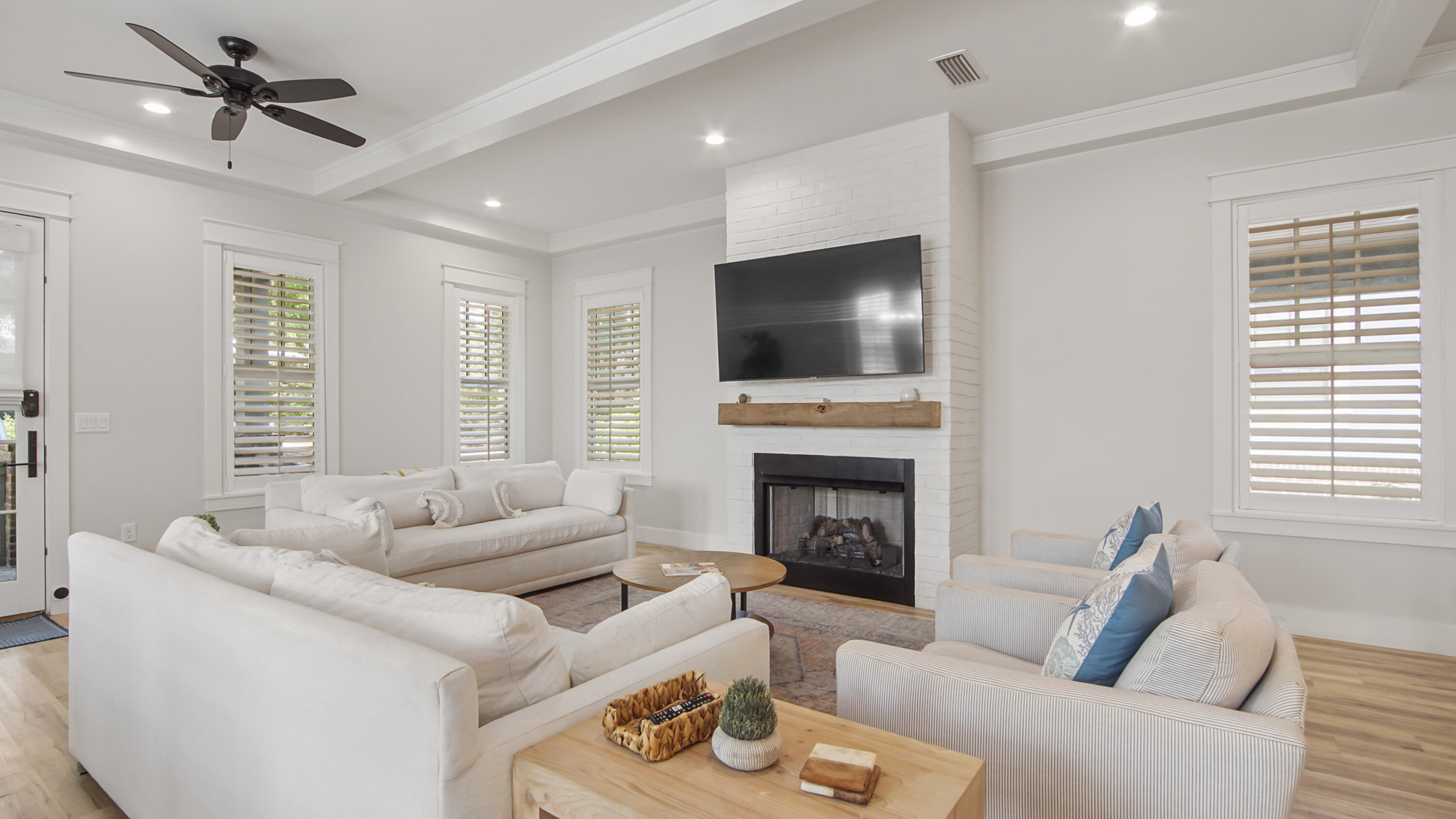 51 Okeechobee West Santa Rosa Beach, FL 32459 - Photo 8 of 78 a living room with furniture a fireplace and a flat screen tv