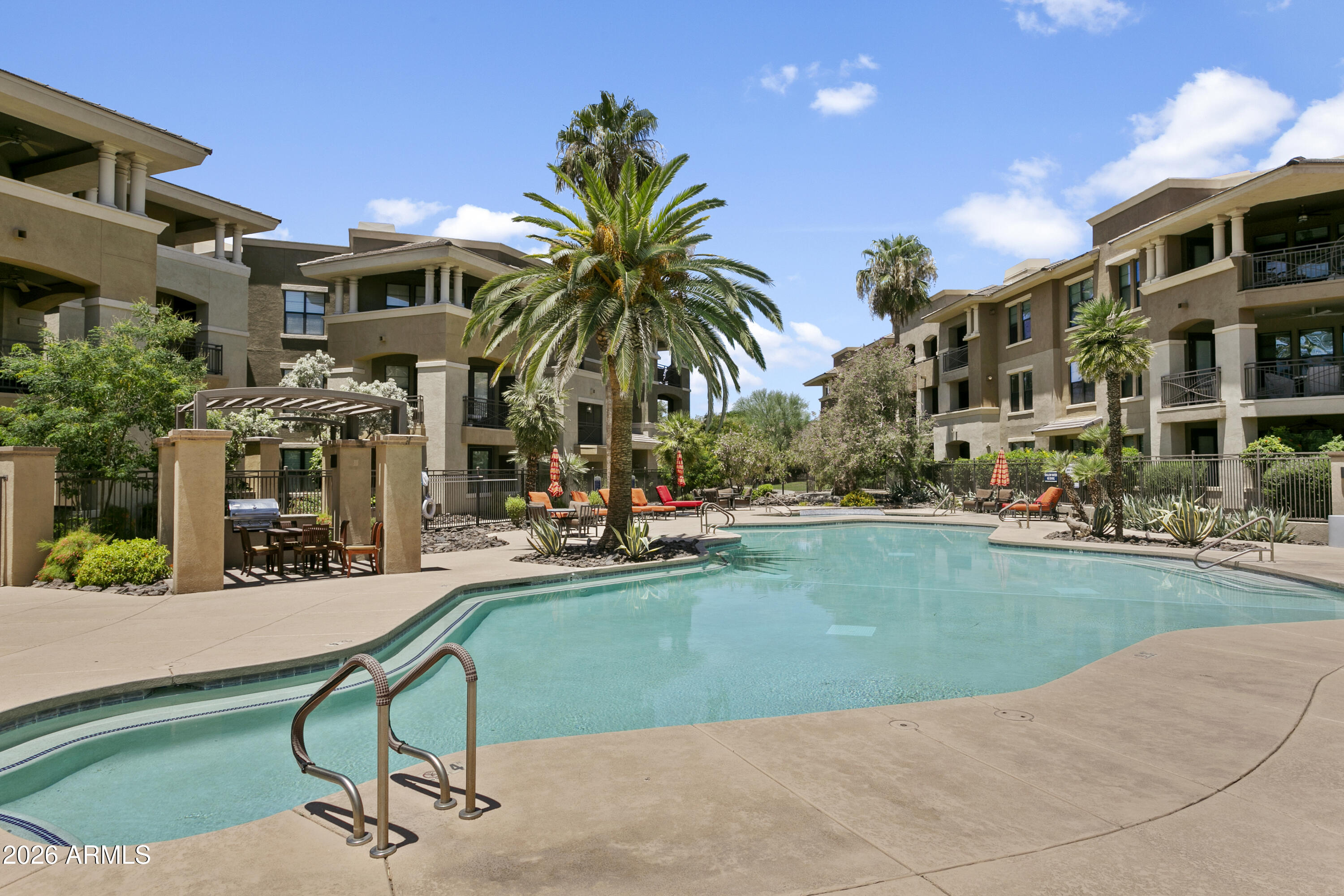 7601 East Indian Bend Road, Unit 1017 Scottsdale, AZ 85250 - Photo 28 of 49 a view of a backyard with a patio