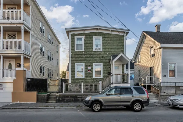 a view of a car parked in front of a building