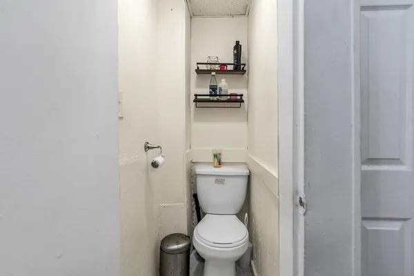 a bathroom with a toilet and a sink