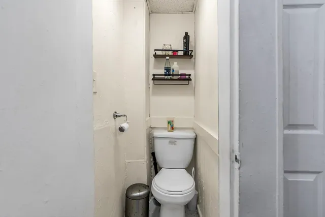 a bathroom with a toilet and a sink