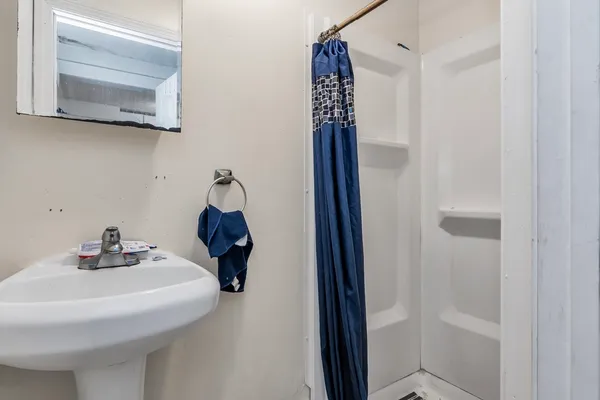 a bathroom with a sink and mirror