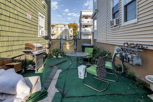 a view of a chairs and tables in patio