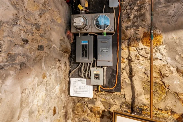 a sign on a wall next to a wall