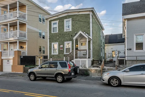 a car parked in front of a house
