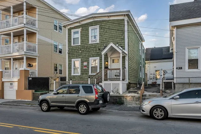 a car parked in front of a house