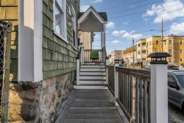 a view of a house with wooden stairs