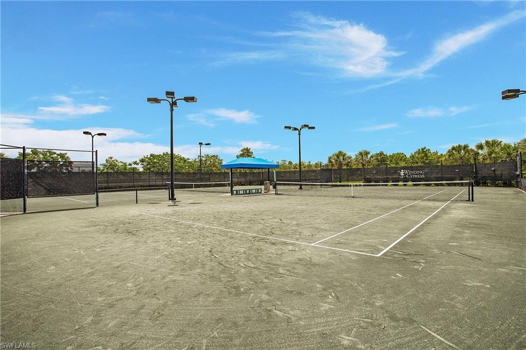 7674 Jacaranda Lane Naples, FL 34114 - Photo 42 of 45 a view of a tennis court